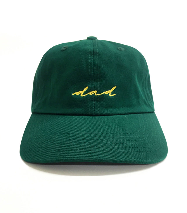 OG Dad Hat – Forest green embroidered 6-panel dad hat with cursive “dad” lettering. A classic golf hat and everyday gift from Dad Brand.